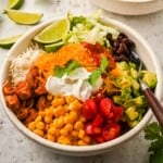 A chipotle chicken bowl with all the toppings loaded.