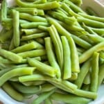 A bowl of cooked green beans.
