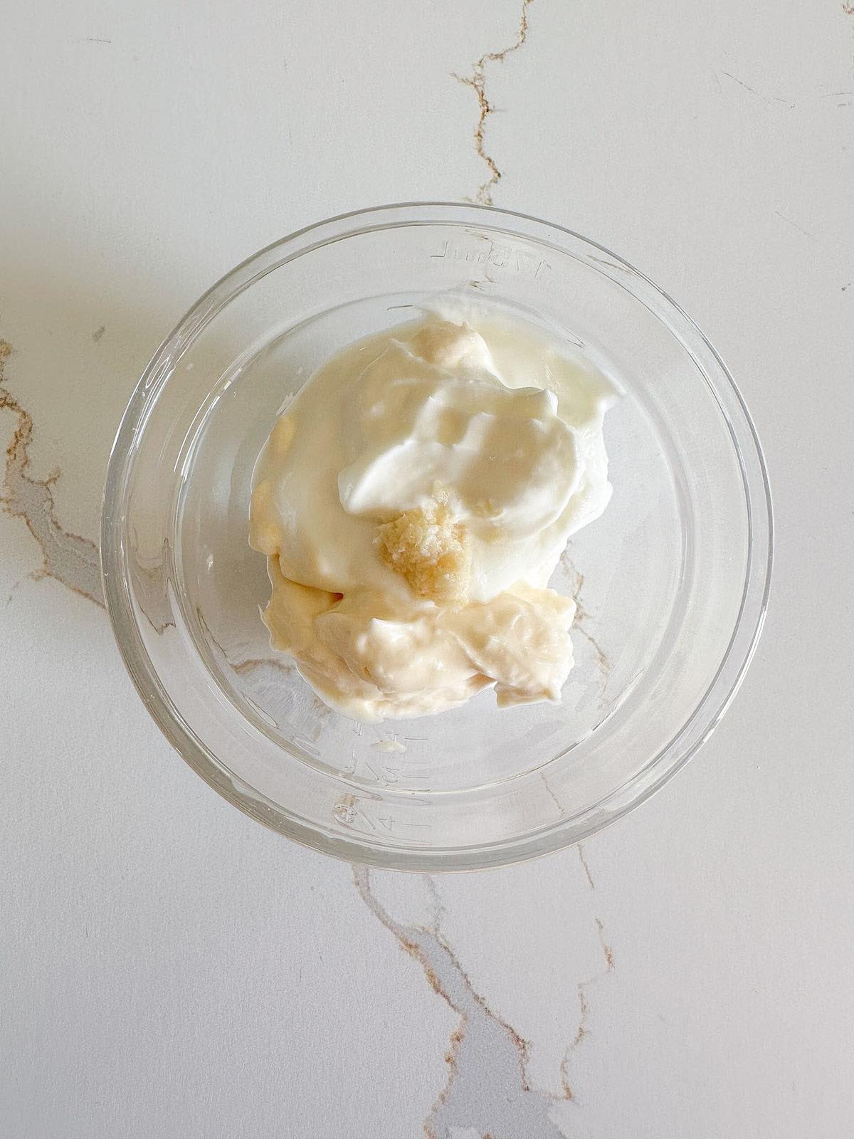 Making the creamy horseradish sauce in a small bowl.