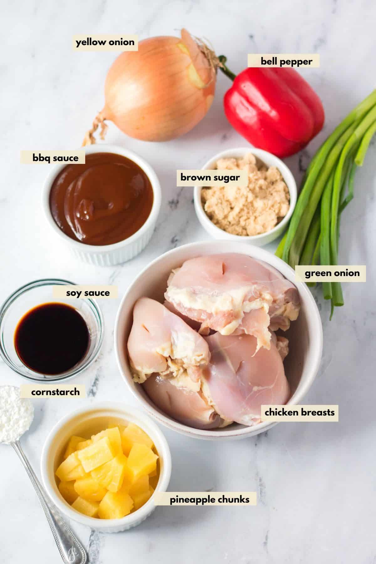 Ingredients for Hawaiian chicken are pineapple, brown sugar, onion, bell pepper, green onions, bbq sauce, soy sauce, brown sugar.