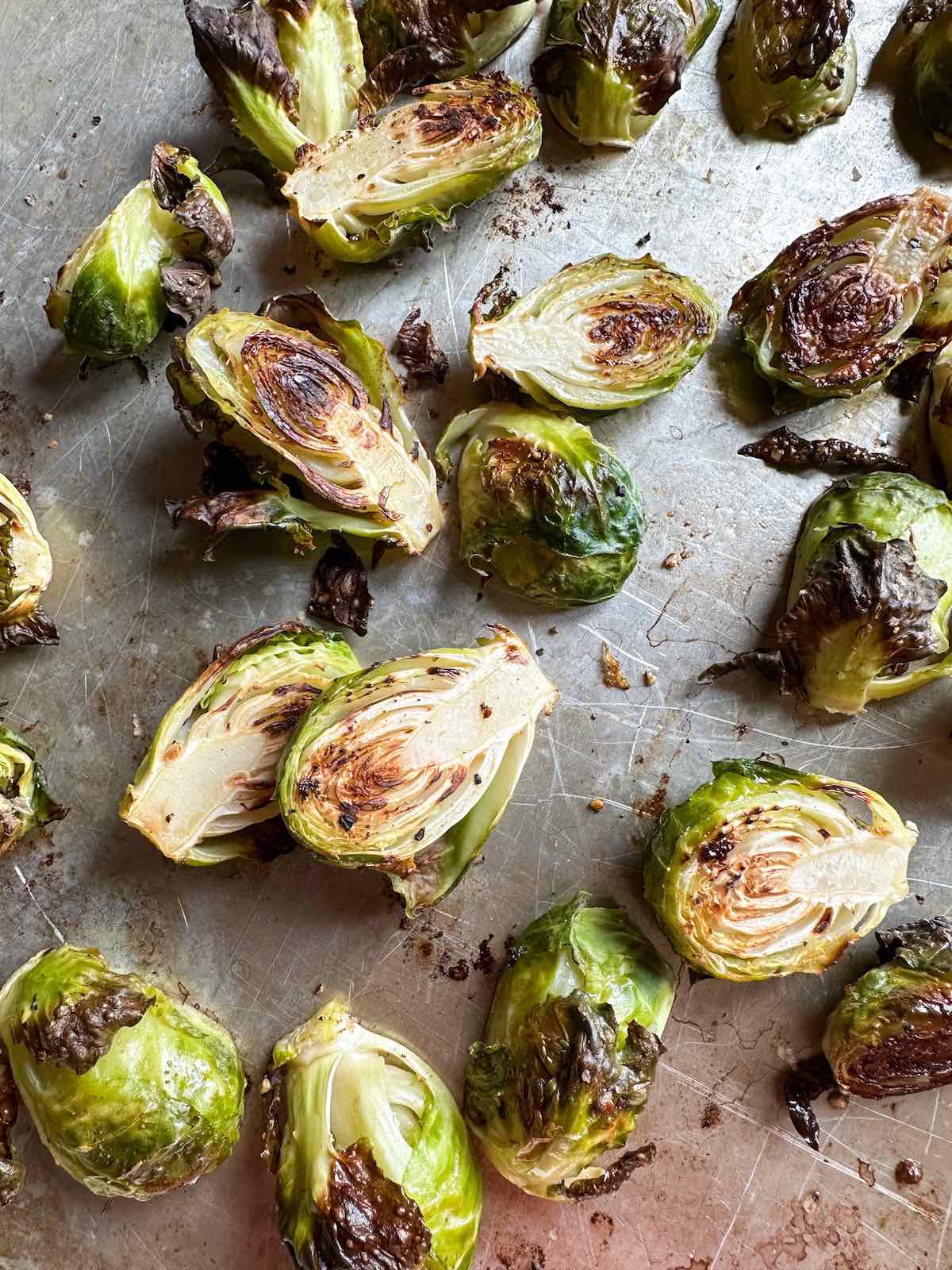 Roasted Brussels sprouts after cooking on a sheet pan.