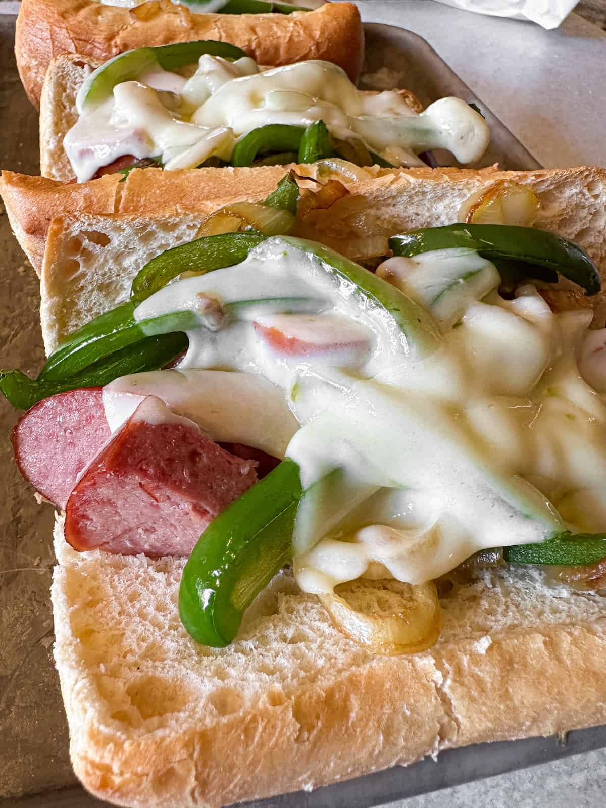 Kielbasa sandwiches with peppers and onions.