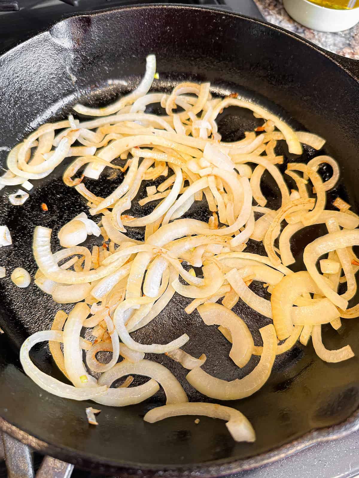 Sauteed onions in a cast iron skillet.