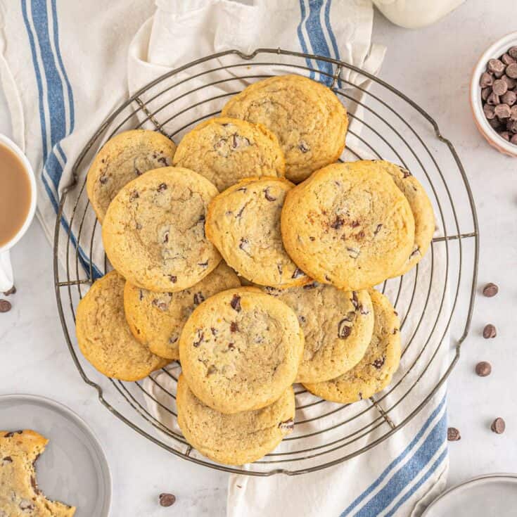 A platter of cream cheese chocolate chip cookies with sprinkled chocolate chips.