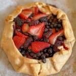 A mixed berry galette with raspberries, blueberries and blackberries after baking.
