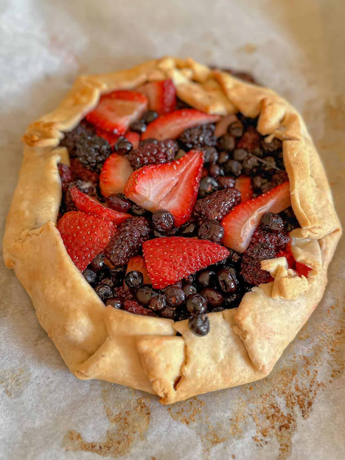 A baked mixed berry galette.