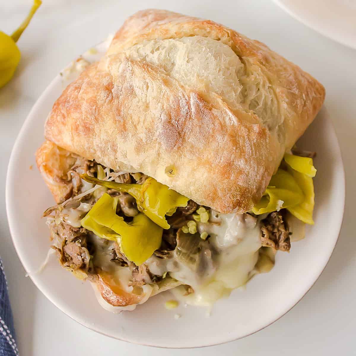 Italian Beef sandwich made in the slow cooker on a sandwich.