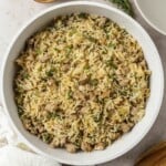 A pan of finished dirty rice with sausage.
