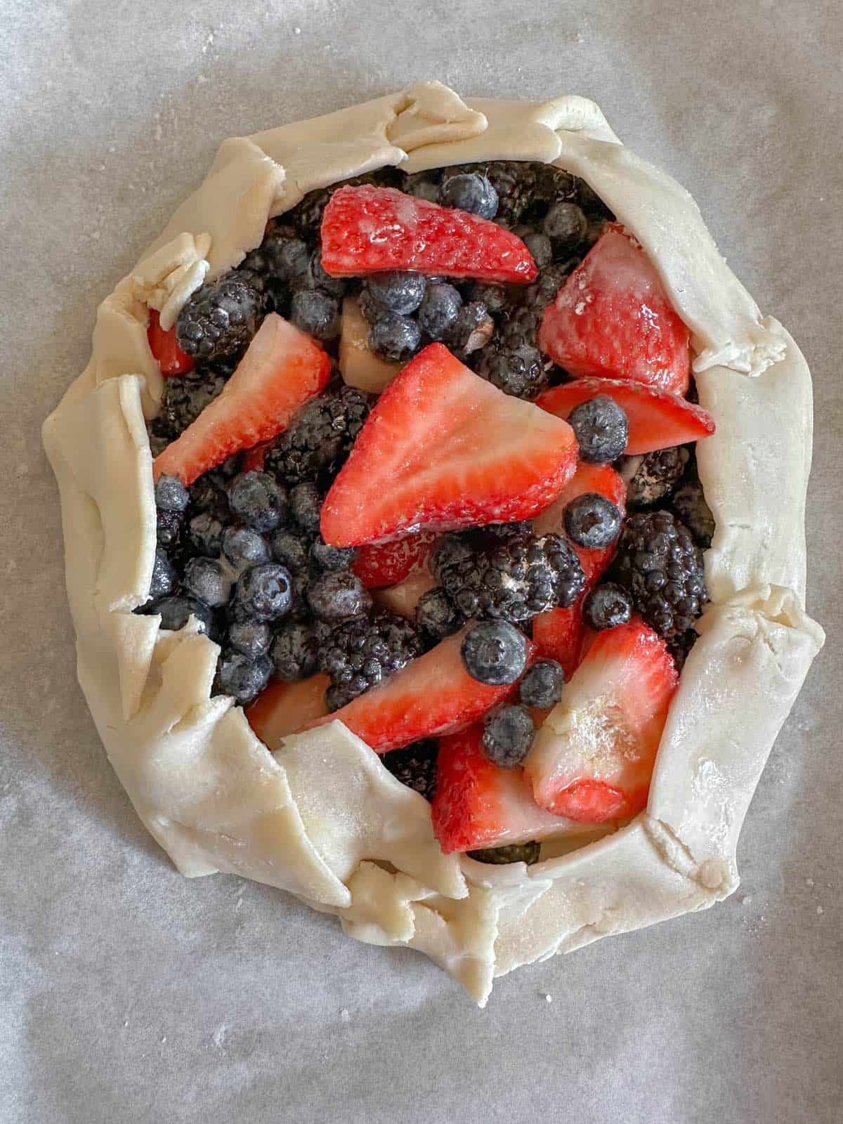 Berries enclosed in an uncooked pie crust.