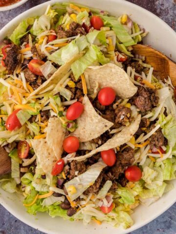 A classic taco salad with ground beef, lettuce, cheese and tortilla chips.