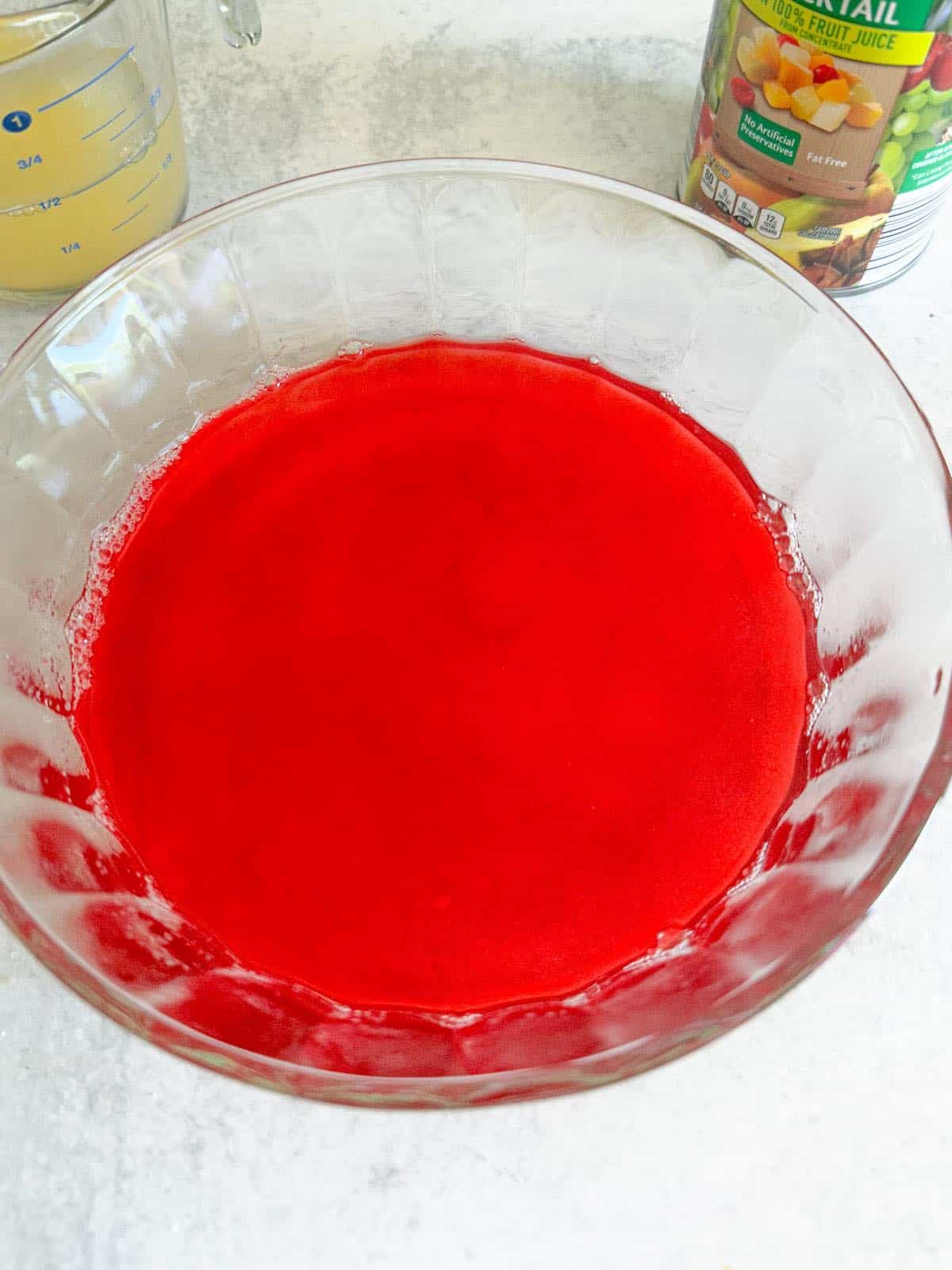 Strawberry jello in a bowl.