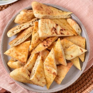 Air fryer pita chips on a plate.