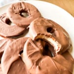 Chocolate covered apples on a plate.
