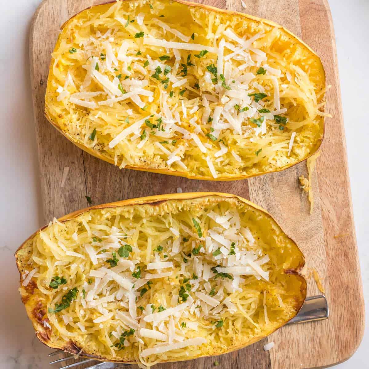 Air fryer spaghetti squash topped with cheese and spices.
