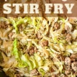 Pork and cabbage stir fry in a pan.