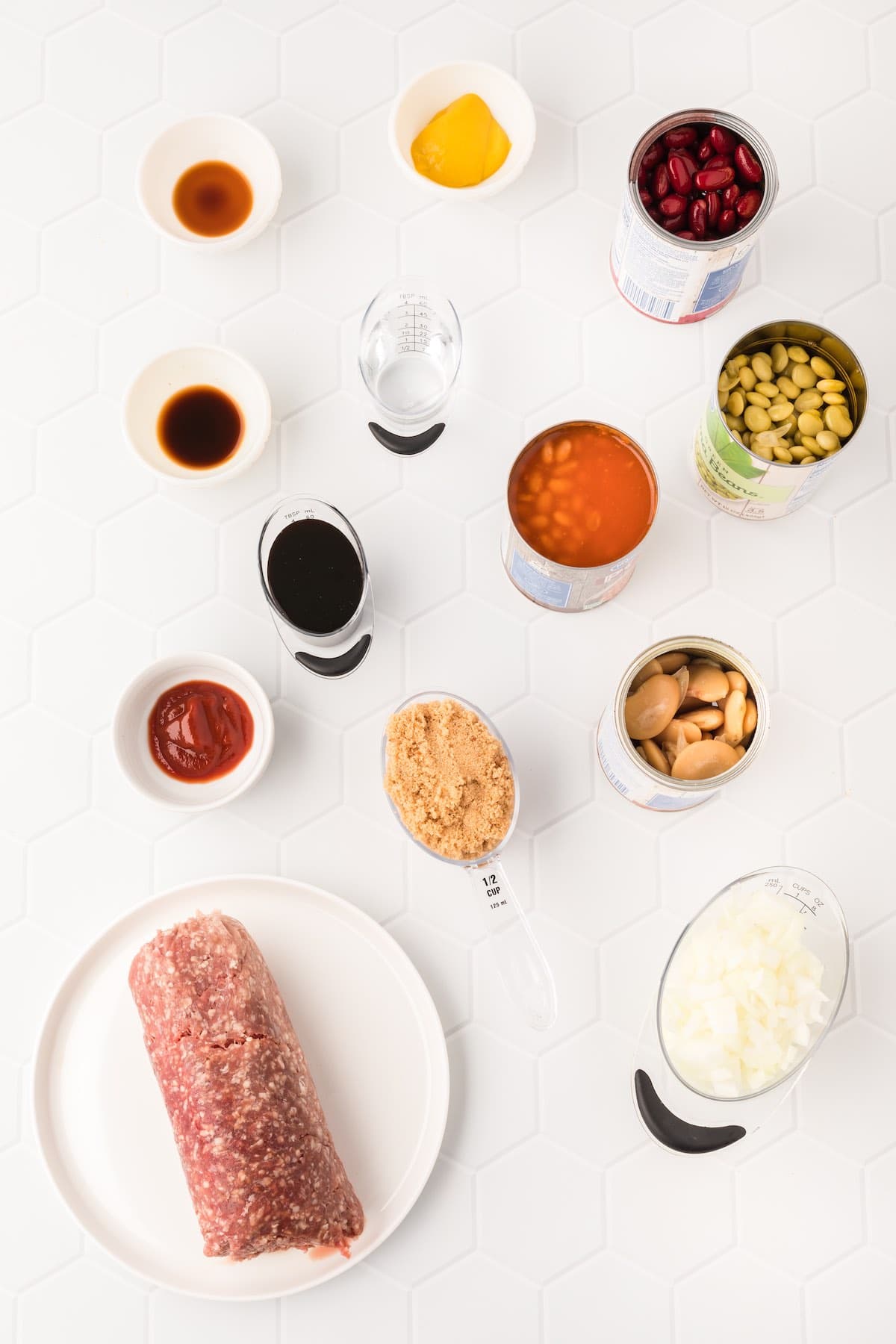 Ingredients to make this cowboy baked beans recipe arranged on a countertop.