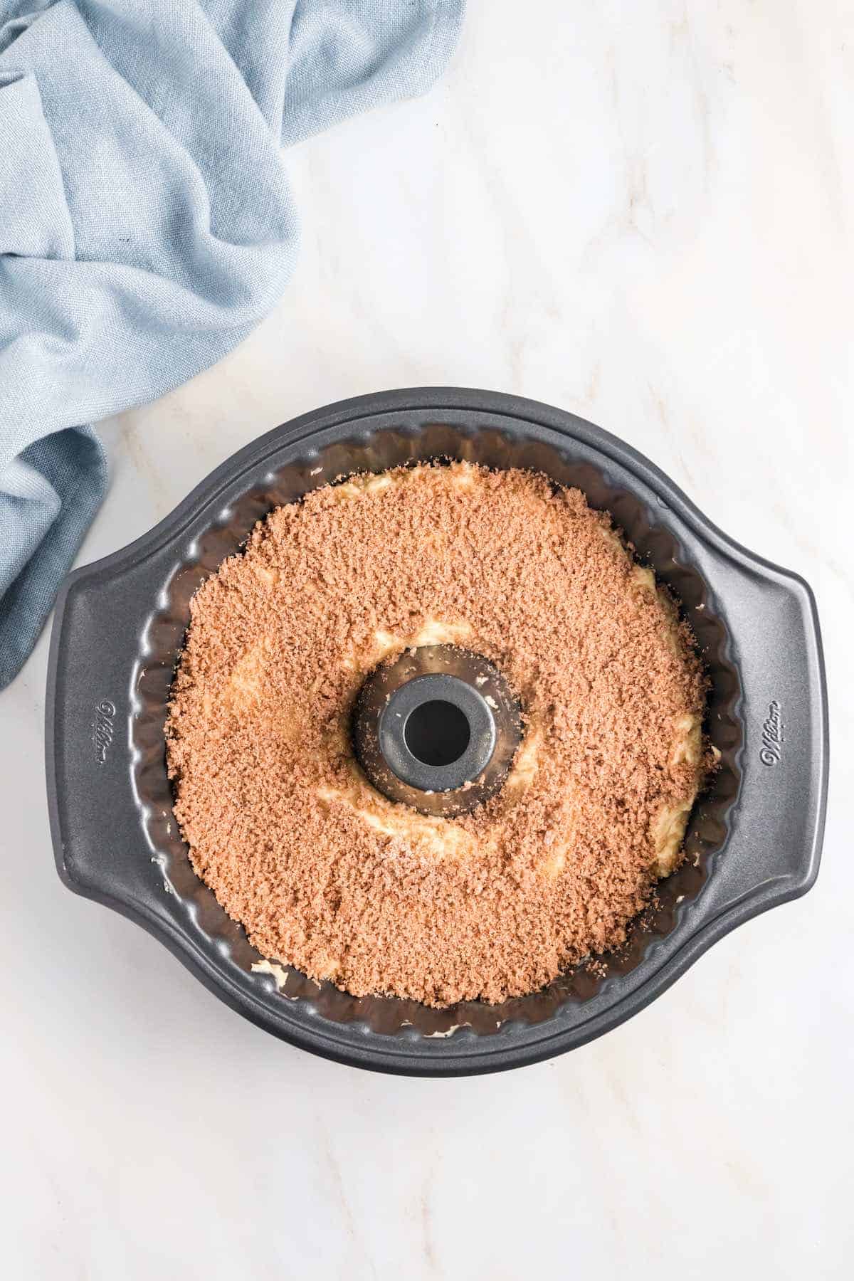 A sour cream bundt cake in a pan before baking.