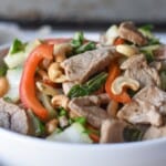 Keto pork stir fry with cashews and bell peppers in a bowl.