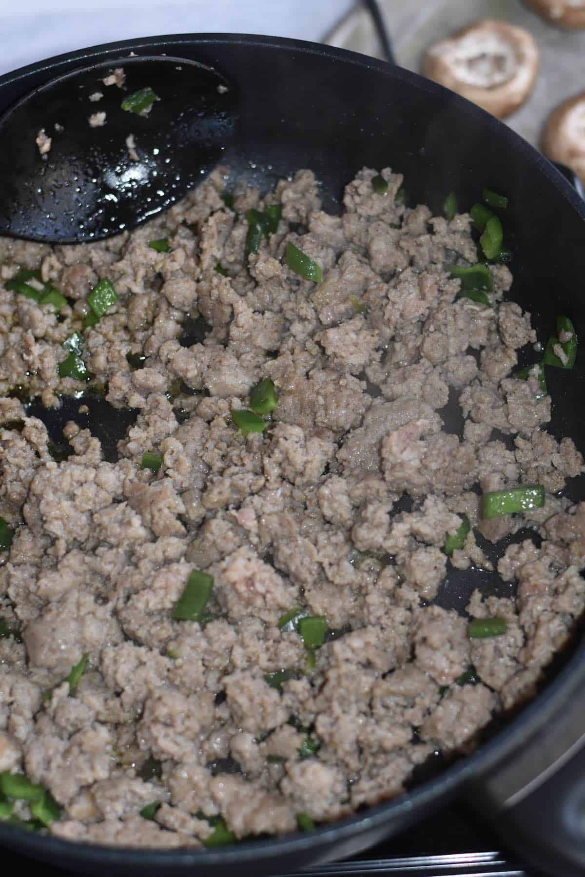 Cooked ground pork sausage in a skillet.