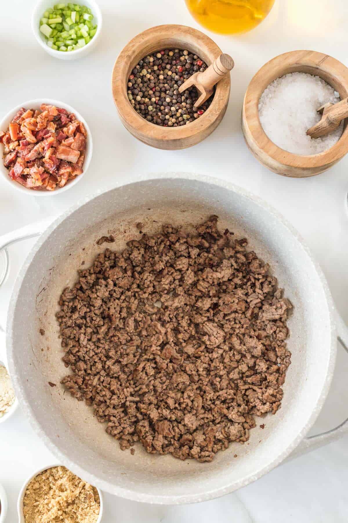 Cooked ground beef in a Dutch oven.