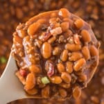 A spoonful of hamburger baked beans.