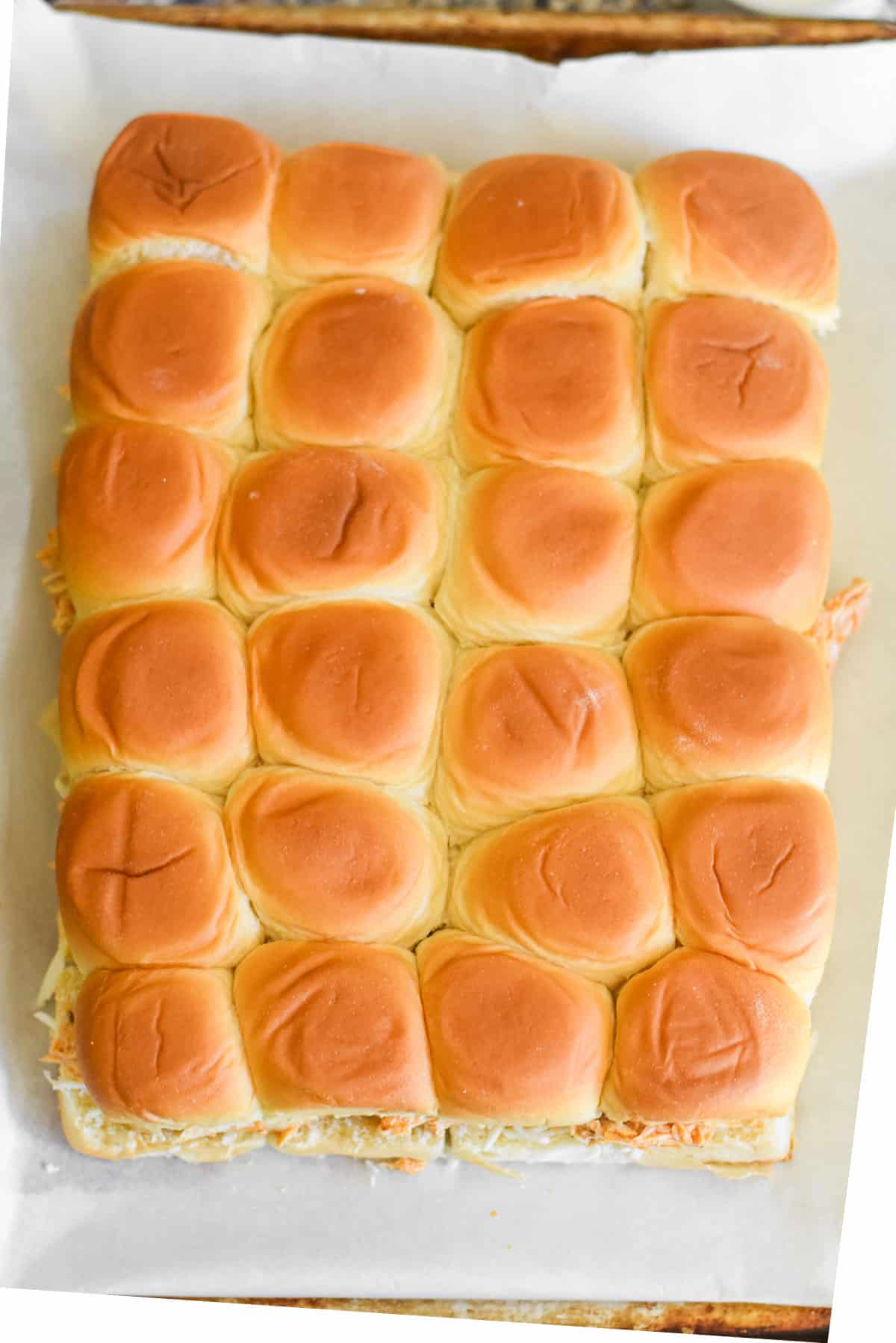 Slider sandwiches on a sheet pan.