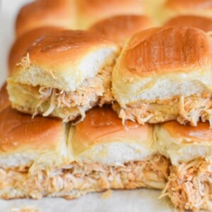 A stack of shredded chicken buffalo sliders.