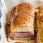 Ham and cheese funeral sandwiches layered in baking dish ready to bake.