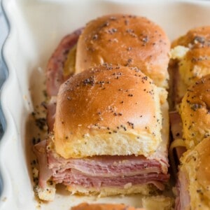 Ham and cheese funeral sandwiches layered in baking dish ready to bake.