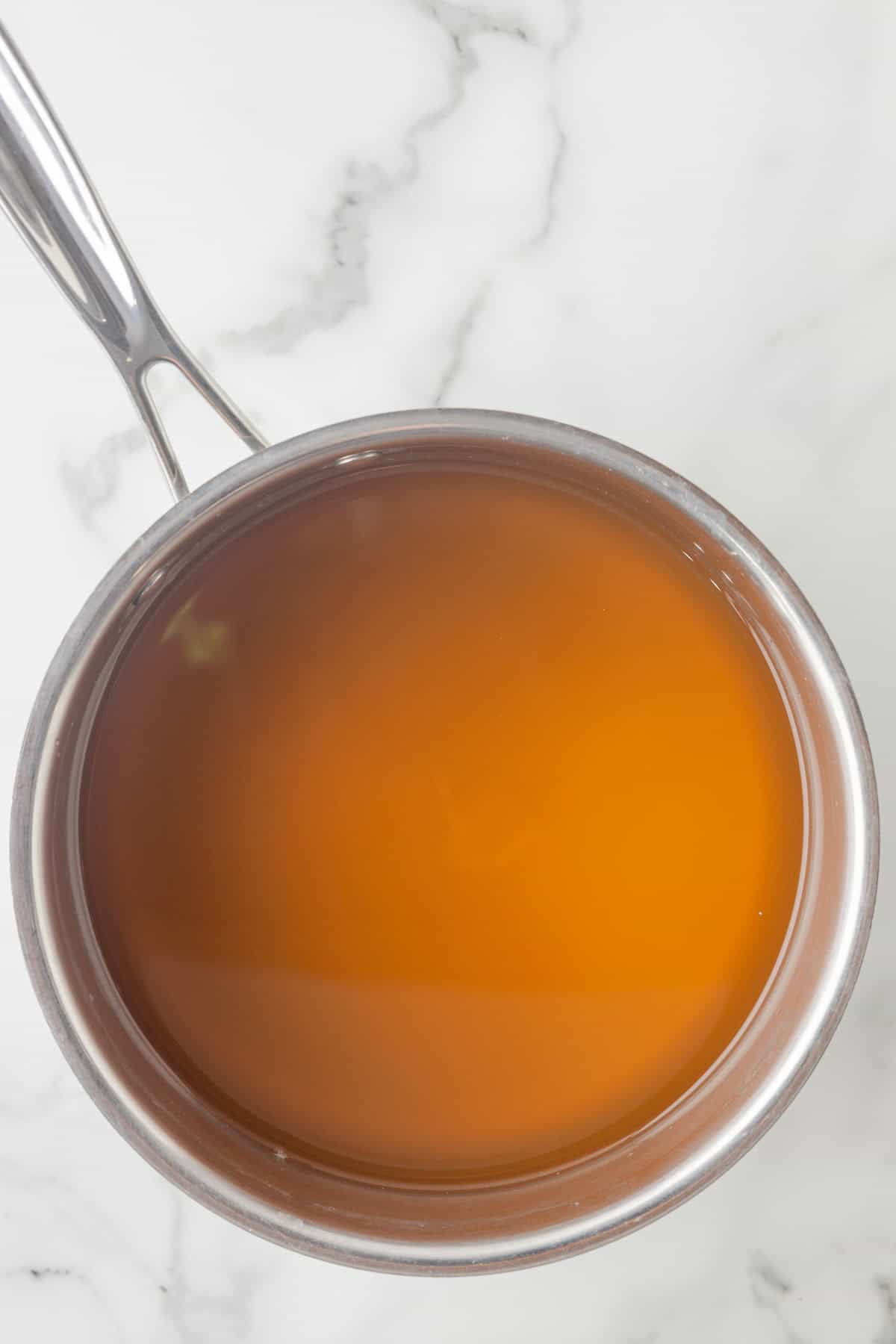 Vegetable broth in a saucepan.