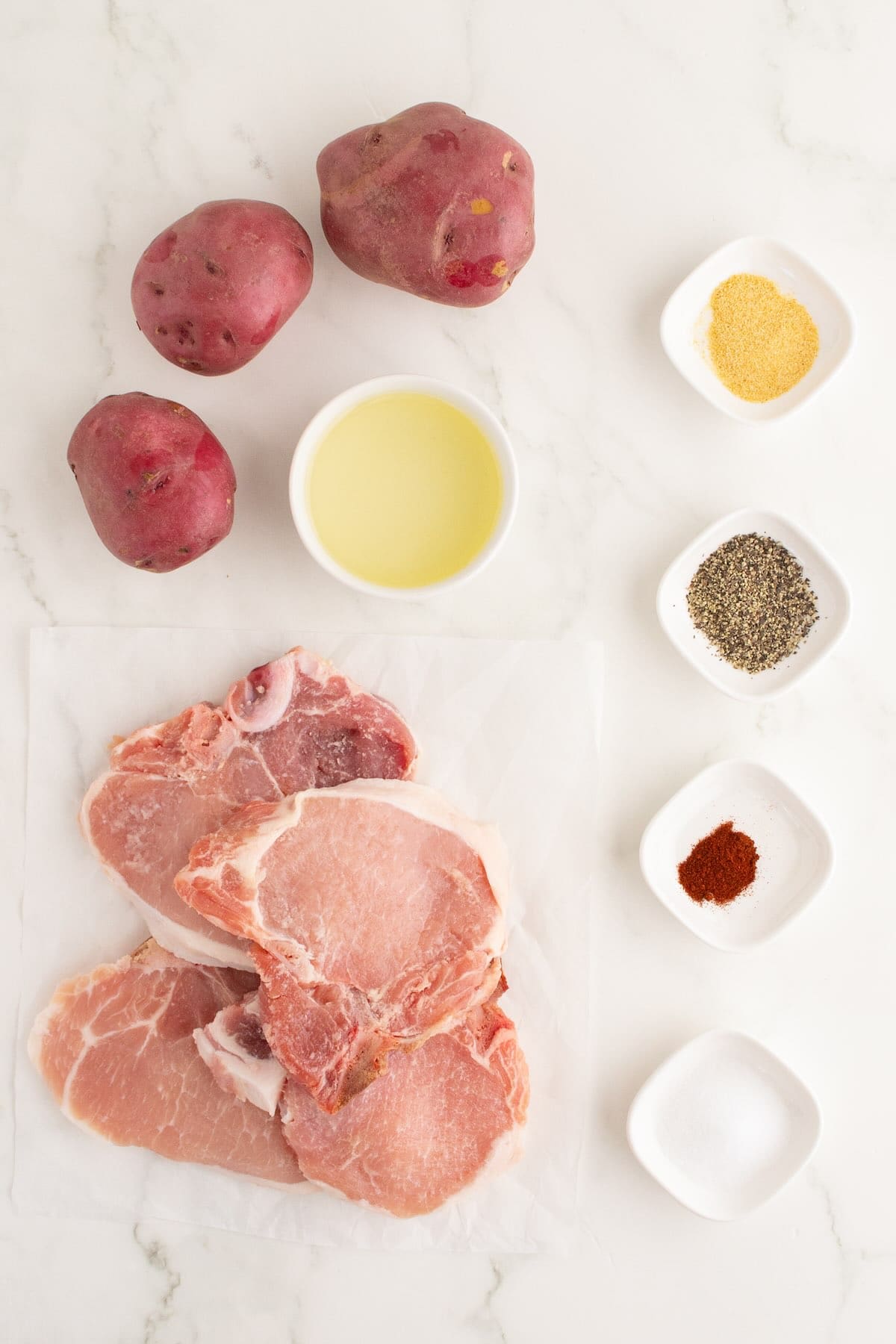 Ingredients to make baked pork chops and potatoes.