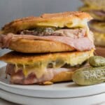 Cubano sandwiches with pickles, ham, pork and mustard.