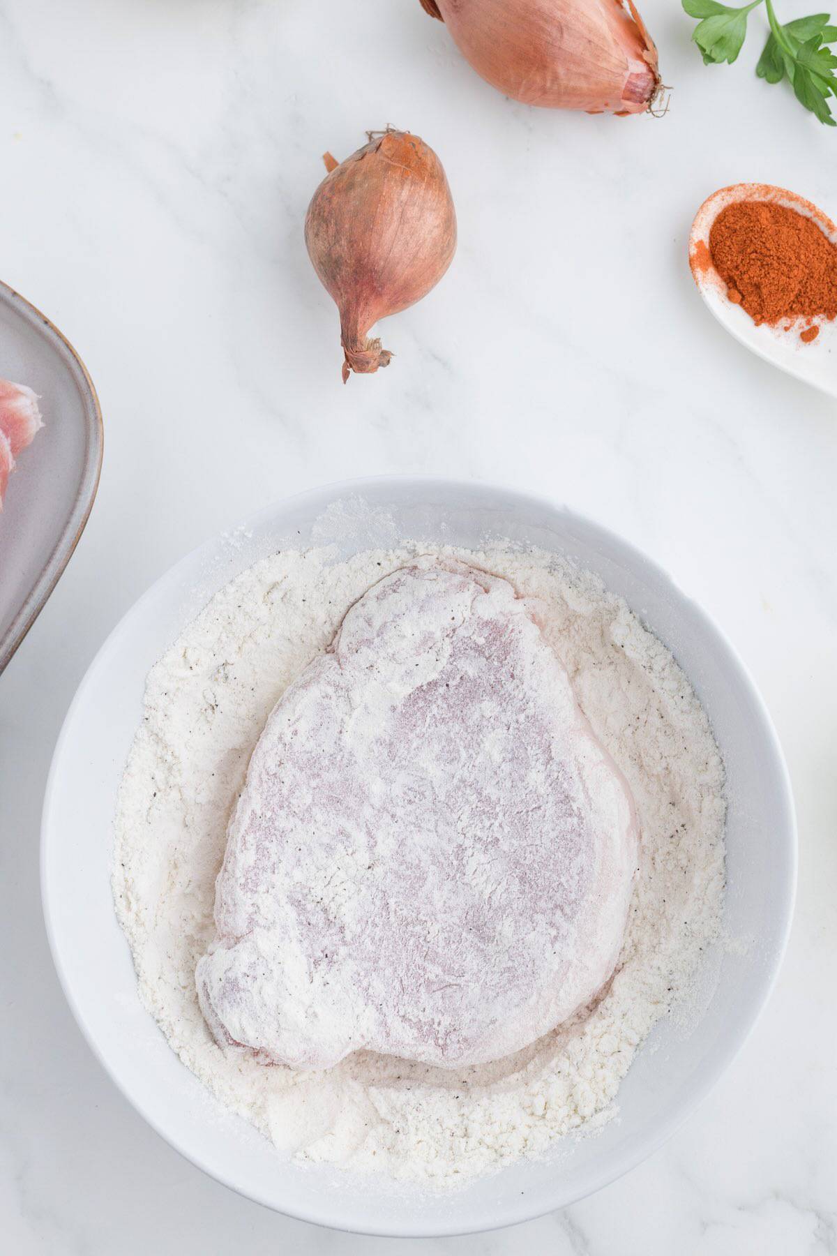 Flour dredged pork chops.