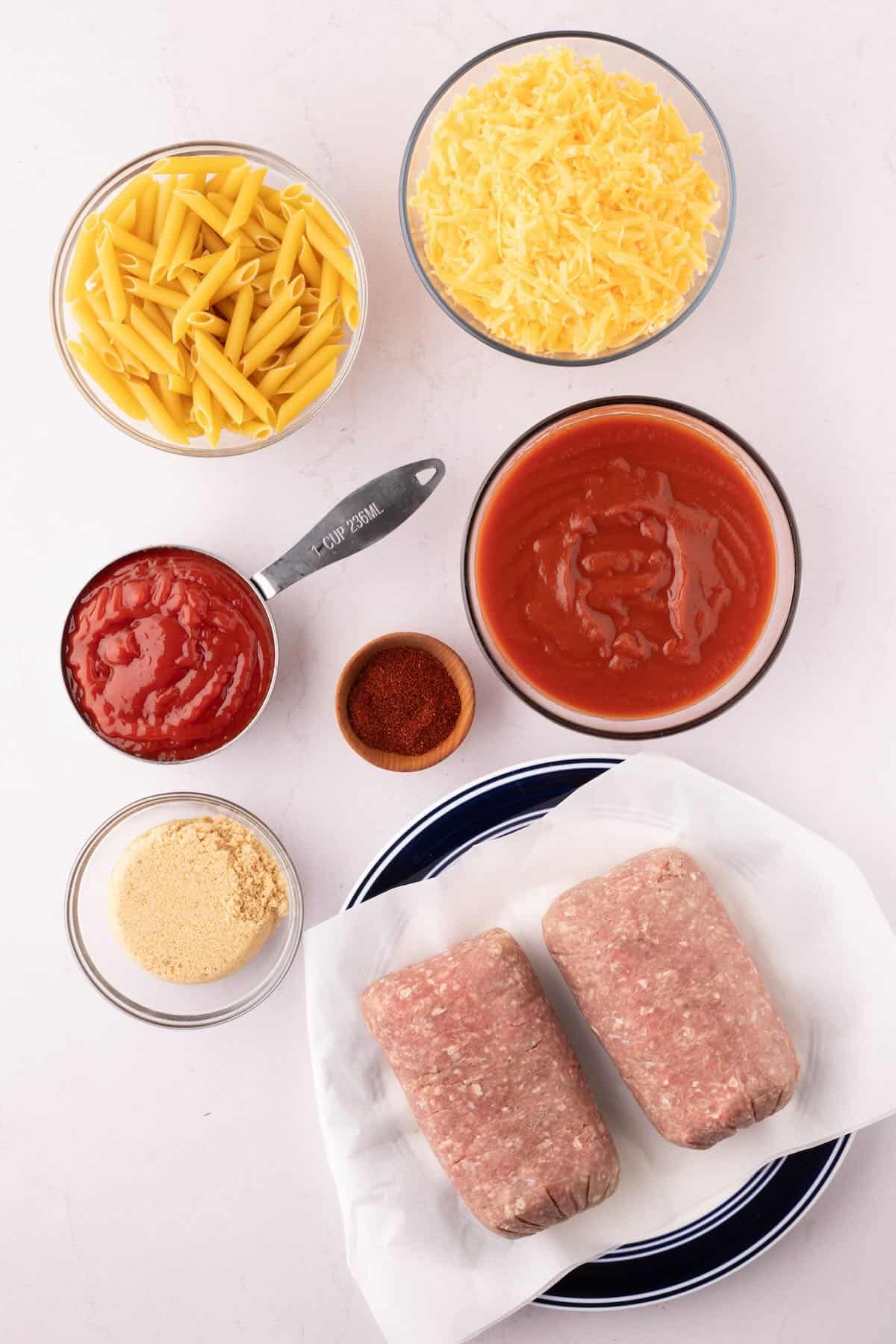 Ingredients to make a sloppy joe casserole with cheese.
