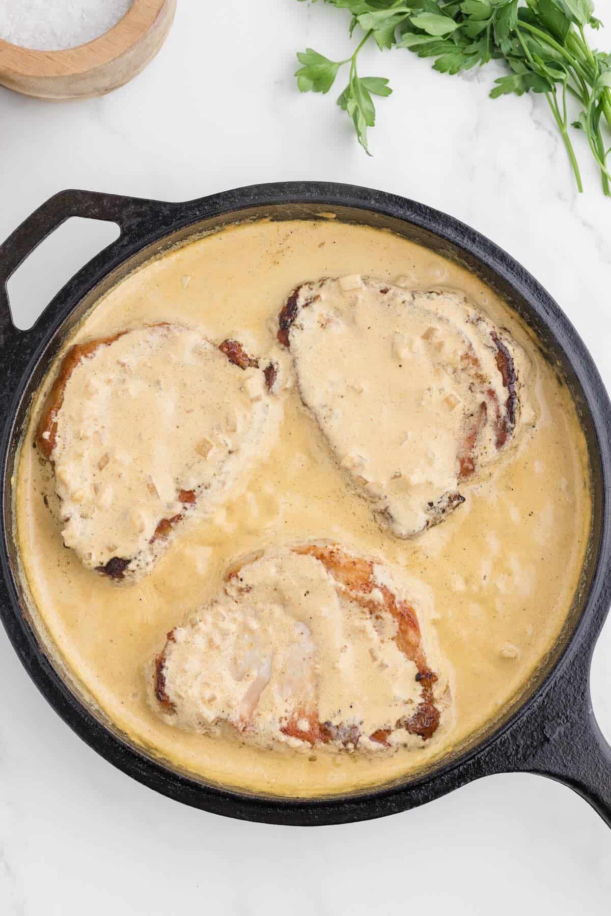 Smothered pork chops in a creamy sauce.