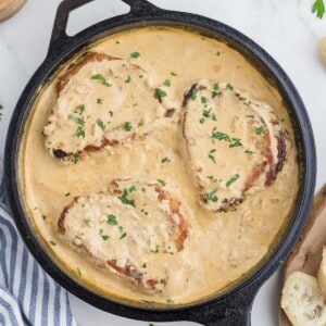 Smothered pork chops in a cream sauce.
