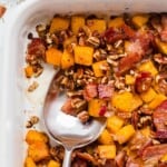 A spoonful of savory squash casserole with bacon.