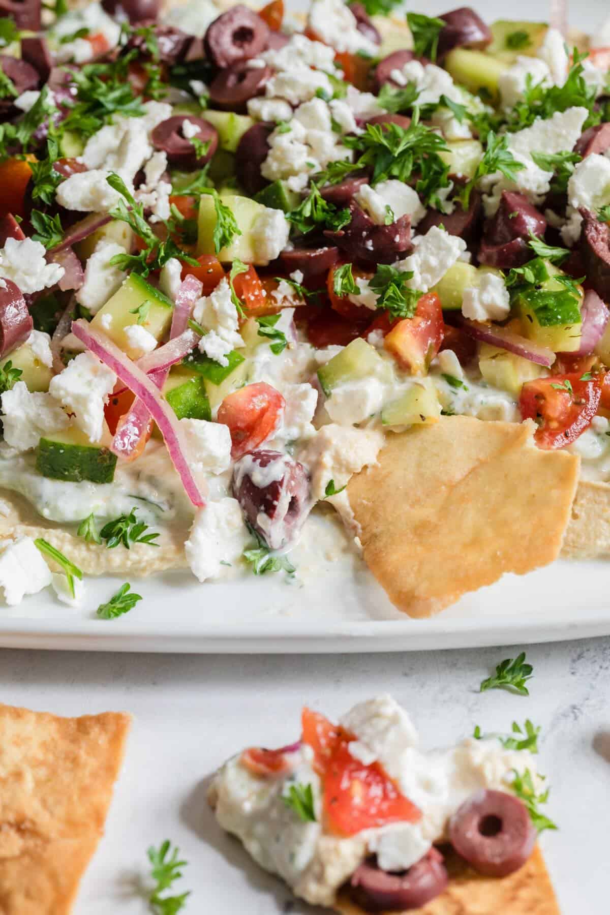 Creamy hummus dip with feta and olives.