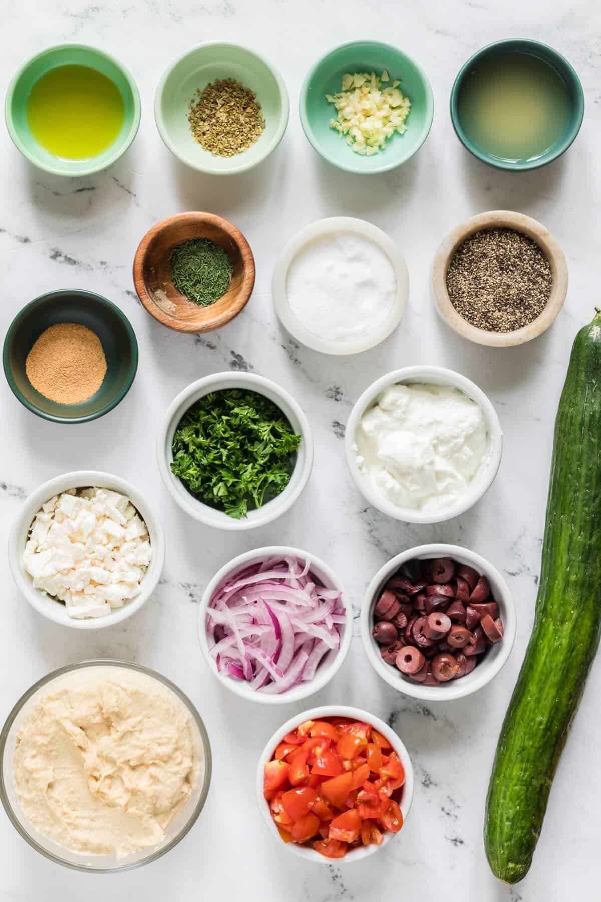 Ingredients to make a layered hummus appetizer.