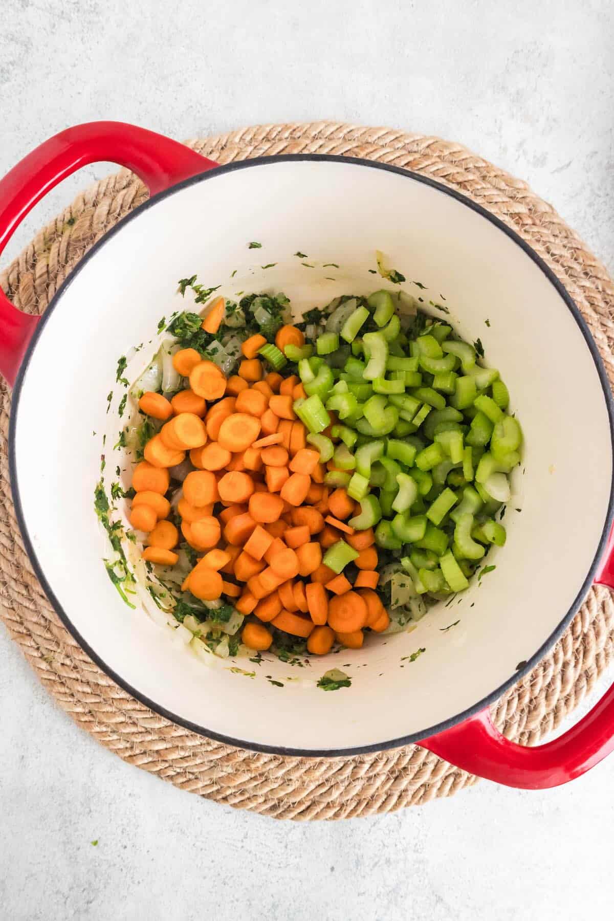 Chopped carrots and celery in a large pot.