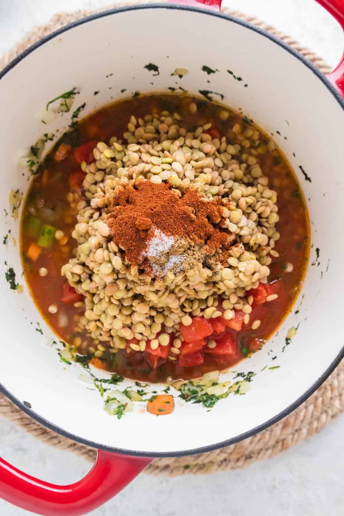 Lentils and vegetables in a large pot.
