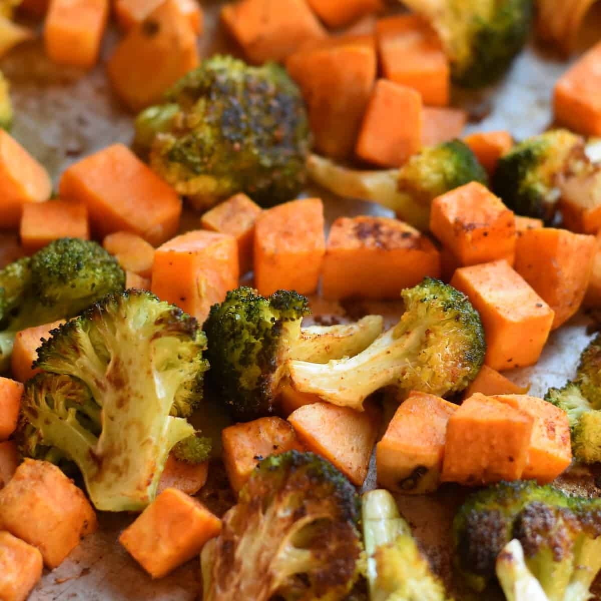 Golden-brown roasted broccoli and sweet potatoes fresh out of the oven.