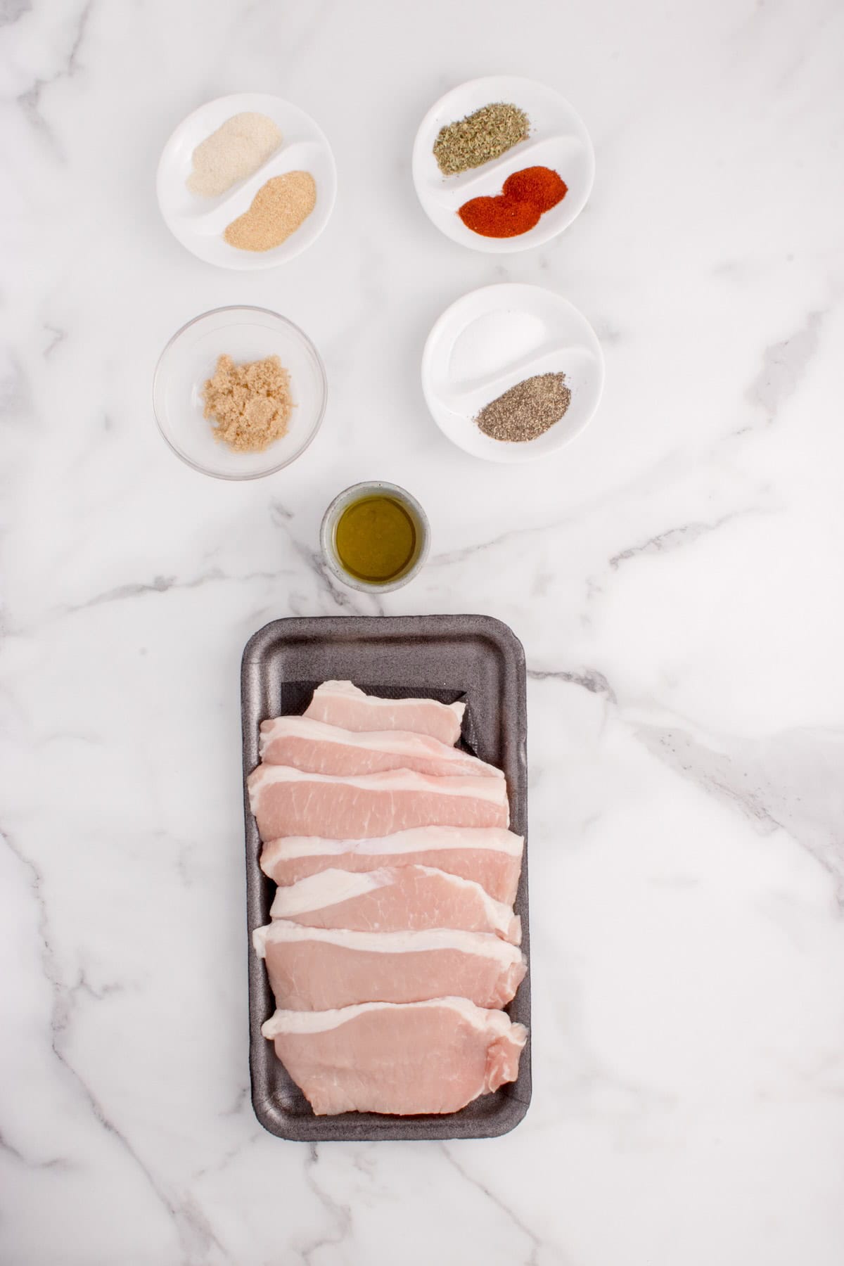 Ingredients to make seasoned pork chops i the air fryer.