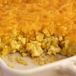 Baked cheesy corn casserole made with Jiffy corn muffin mix in a casserole dish, ready to serve.