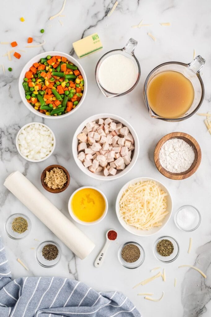 Ingredients to make a chicken pot pie using puff pastry.