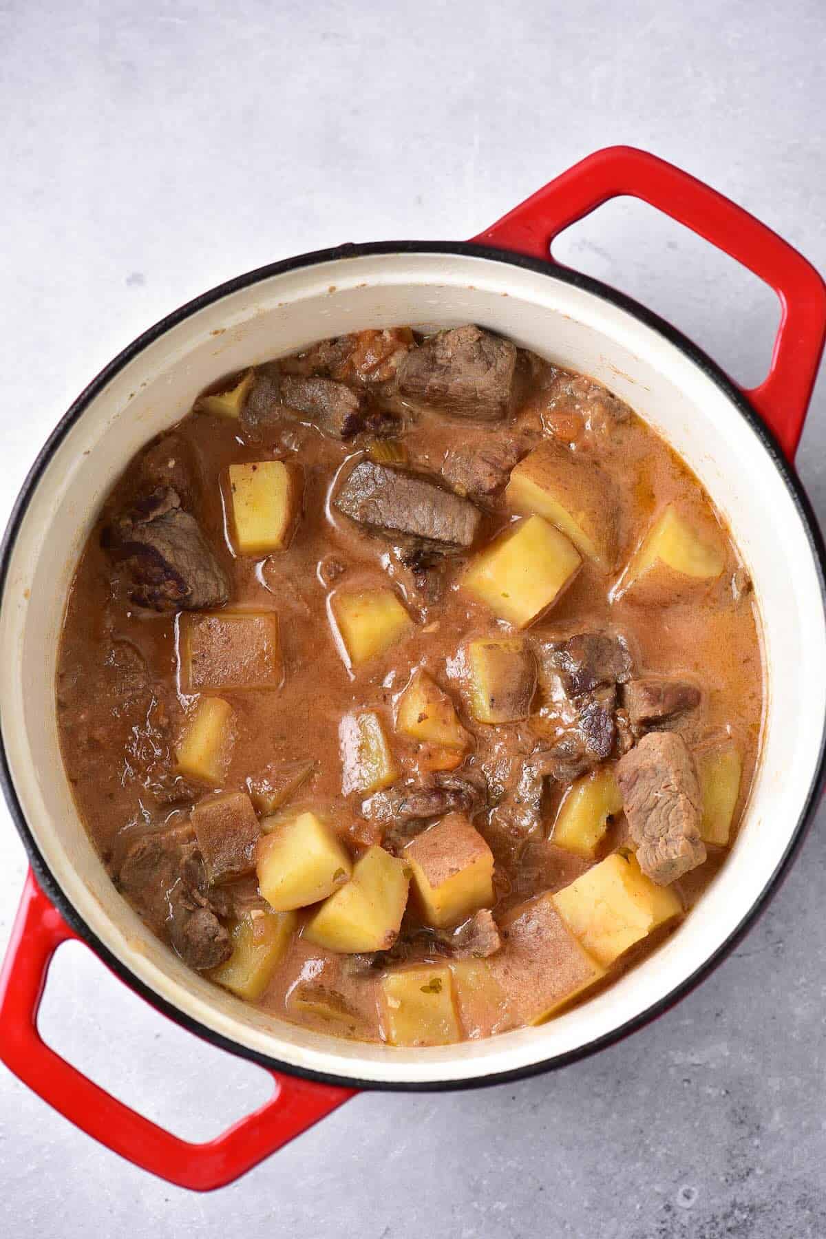 Venison stew in a Dutch oven, ready to serve.