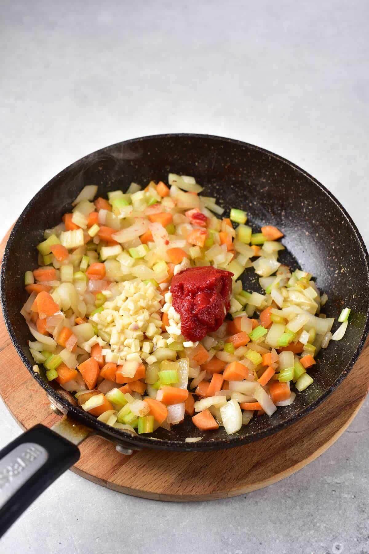 Sautéing carrots, celery, and onion for venison stew base.