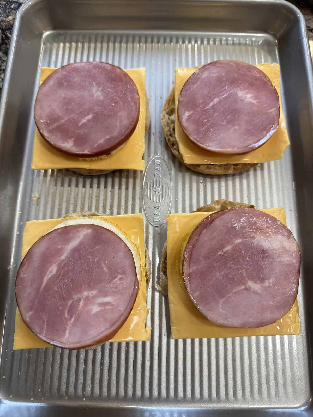Canadian bacon slices on egg sandwiches.