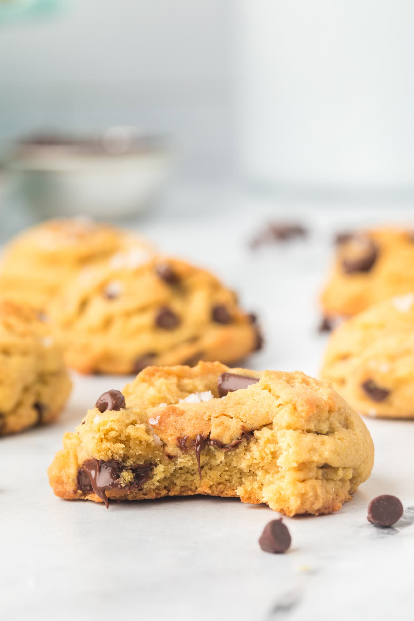 Close-up of a brown butter chocolate chip cookie showing gooey chocolate and golden edges.