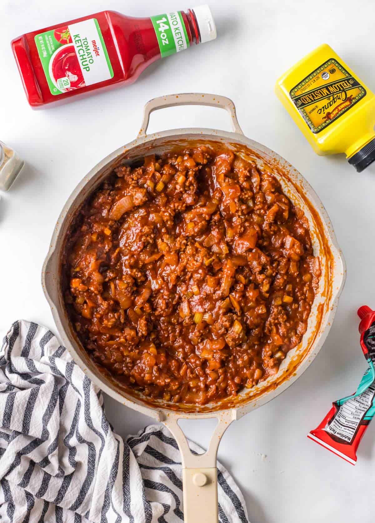 Thick, saucy homemade sloppy joe sauce with beef mixture in a skillet.